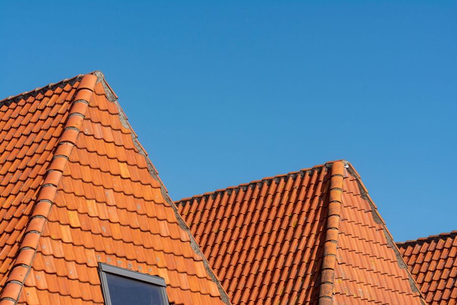 Finished clay tiles on a pitched roof